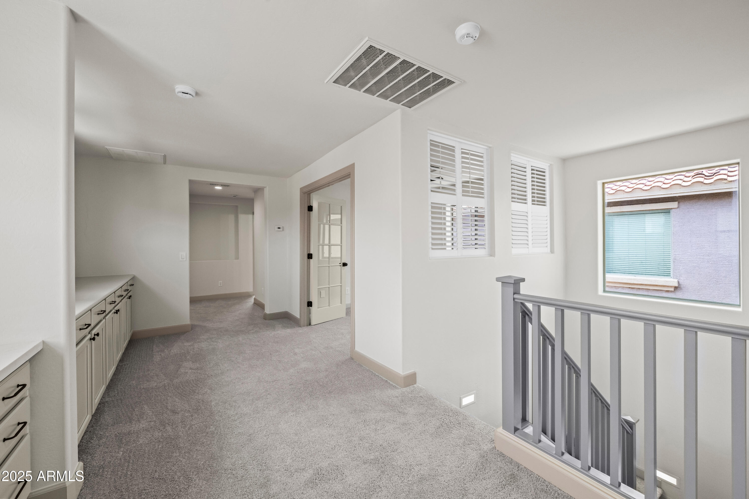 3745 East Flamingo Way Gilbert, AZ 85297 - Photo 20 of 25 a view of an empty room with window and stairs