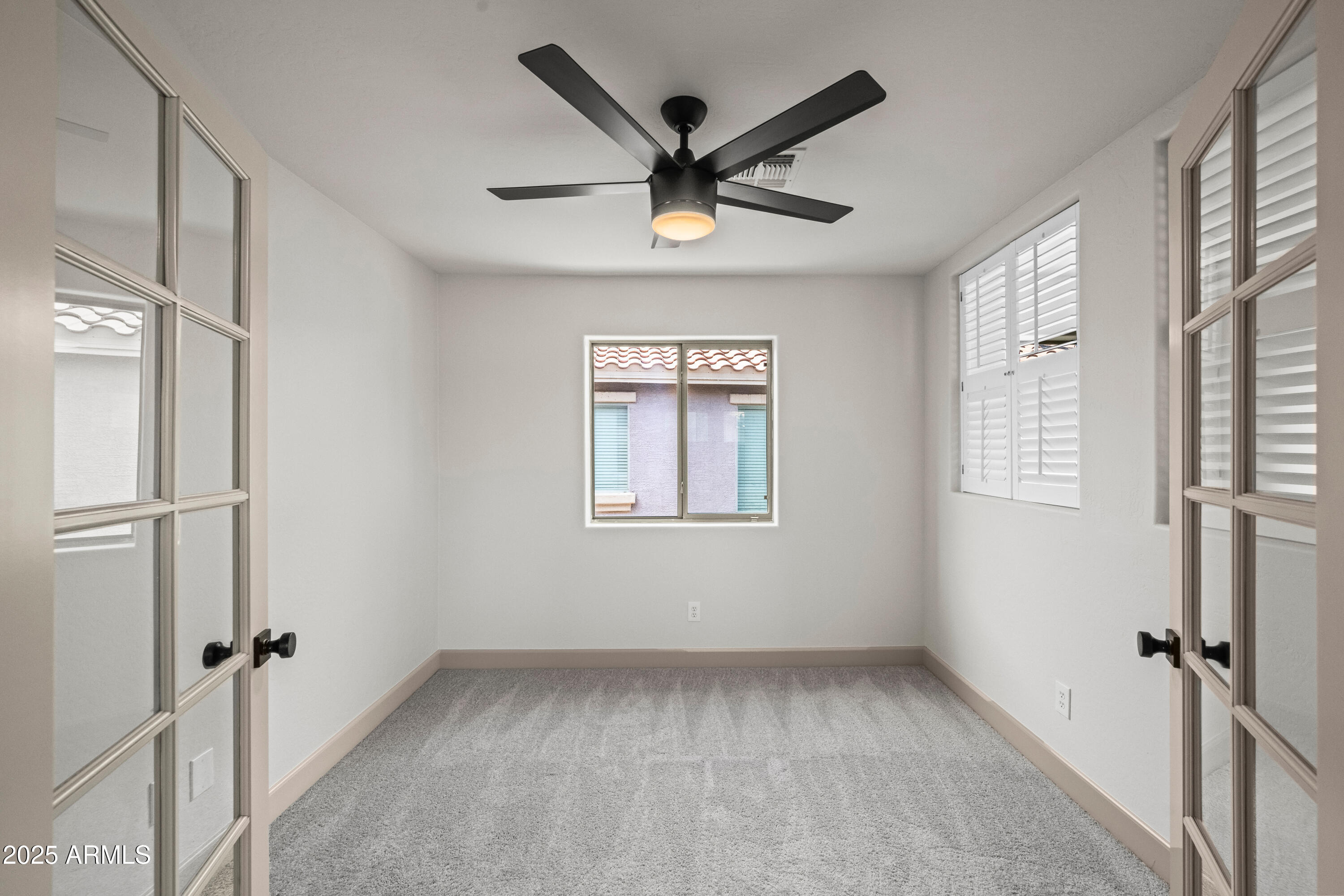 3745 East Flamingo Way Gilbert, AZ 85297 - Photo 21 of 25 a view of a livingroom with a ceiling fan and window