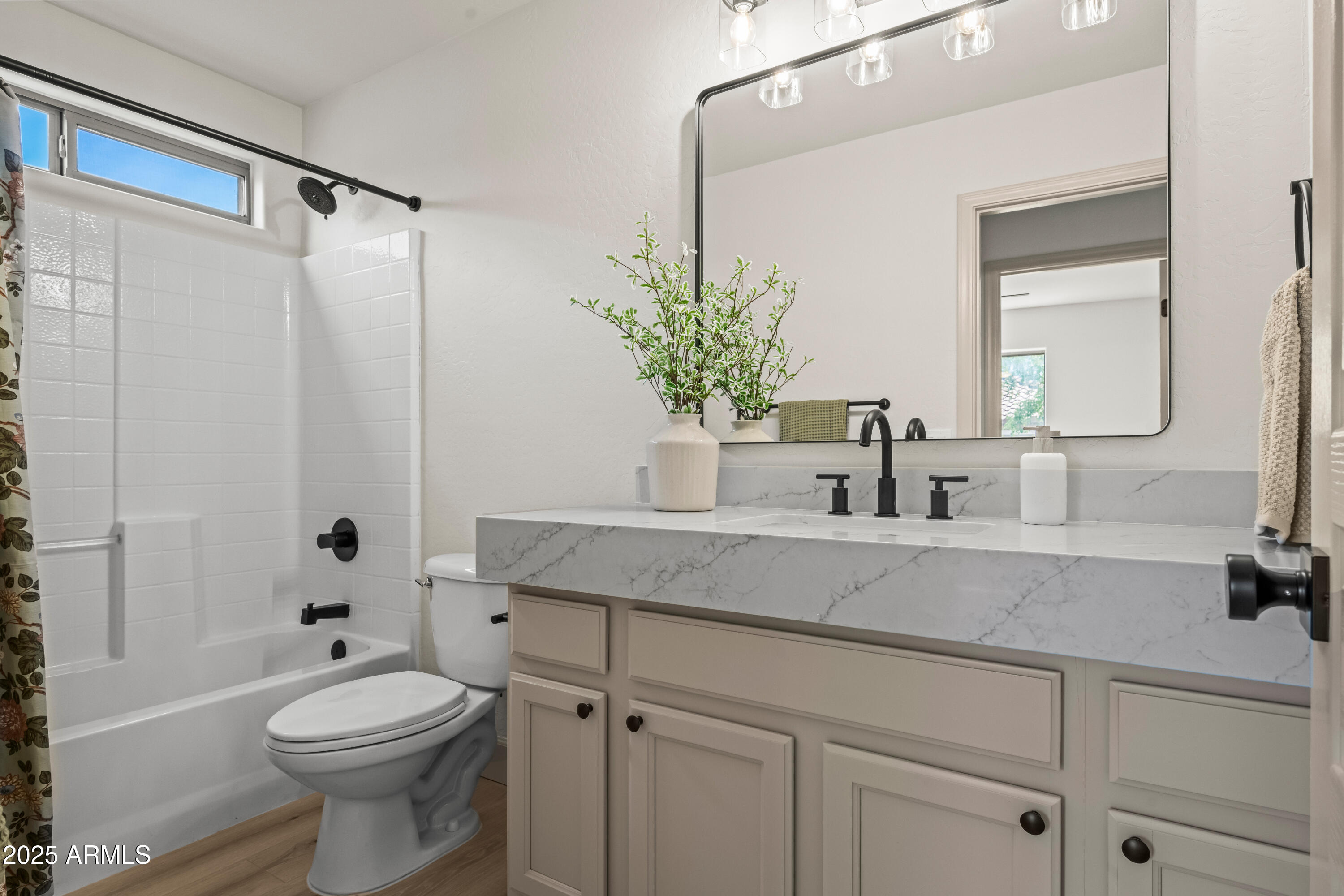 3745 East Flamingo Way Gilbert, AZ 85297 - Photo 5 of 25 a bathroom with a sink a toilet and shower