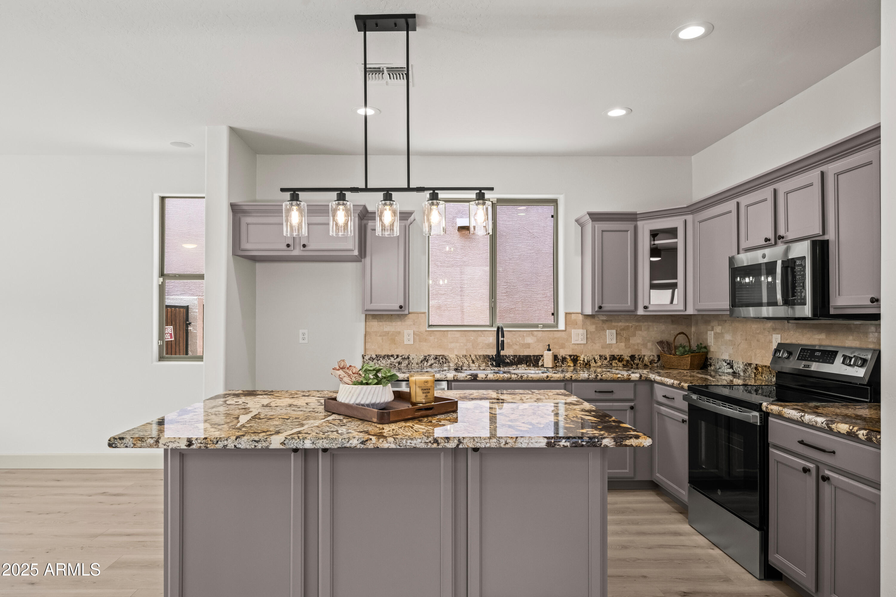 3745 East Flamingo Way Gilbert, AZ 85297 - Photo 6 of 25 a kitchen with stainless steel appliances a sink stove and refrigerator