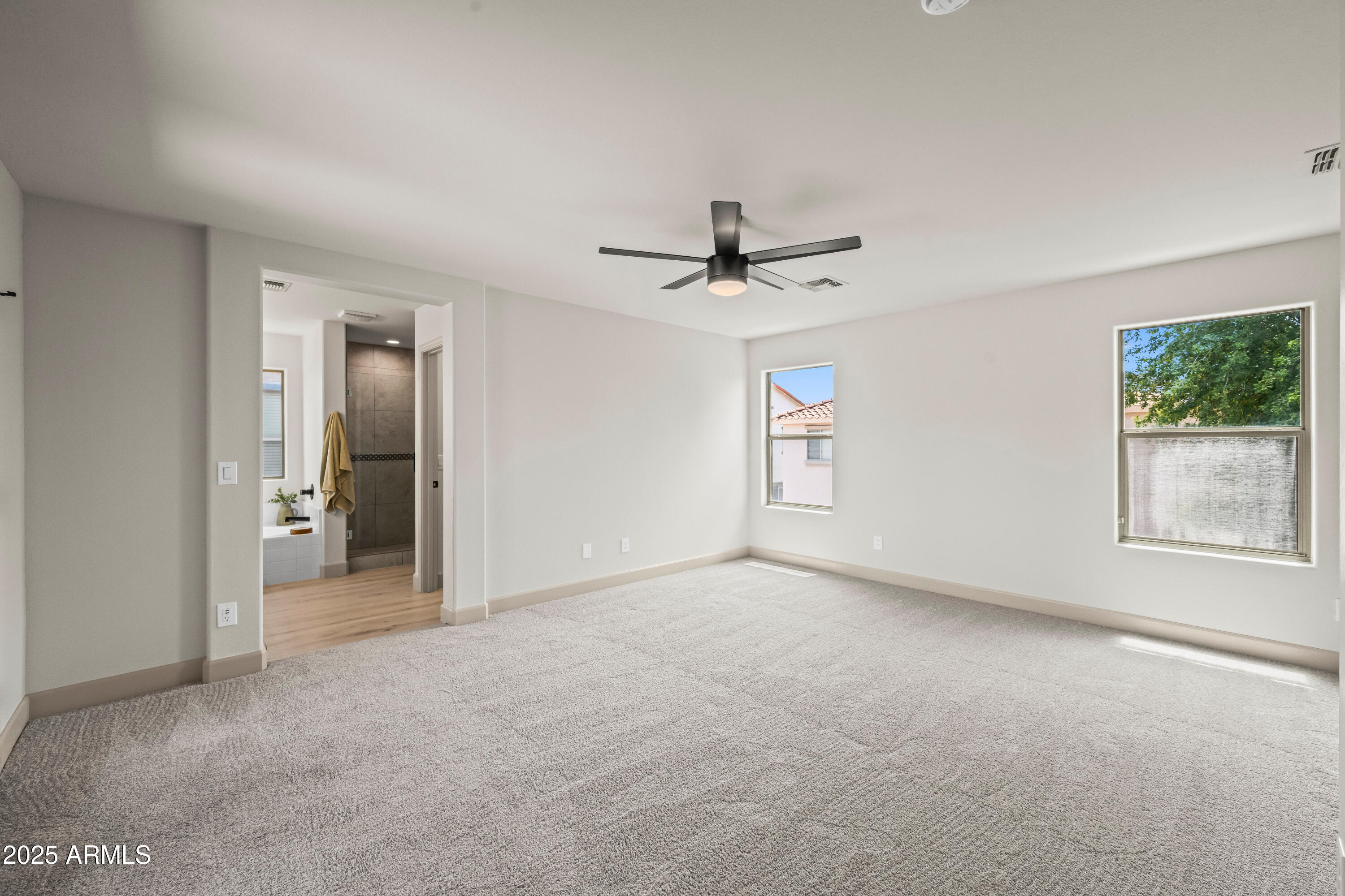 3745 East Flamingo Way Gilbert, AZ 85297 - Photo 9 of 25 a view of a livingroom with a ceiling fan and window