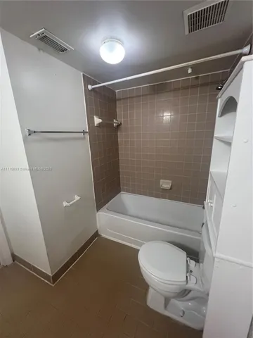 a spacious bathroom with a double vanity sink and mirror