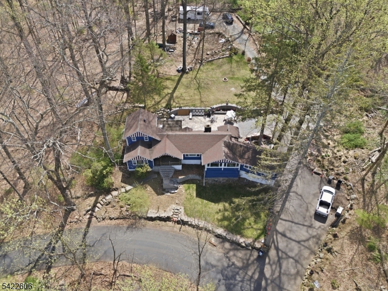 399 Springbrook Trail Sparta, NJ 07871 - Photo 23 of 27 a view of a house with a yard and sitting area