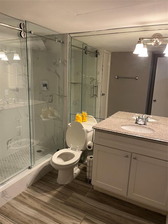 4845 Cedar Springs Road, Unit 170 Dallas, TX 75219 - Photo 18 of 26 a bathroom with a sink toilet and shower