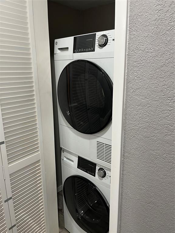 4845 Cedar Springs Road, Unit 170 Dallas, TX 75219 - Photo 19 of 26 a utility room with dryer and washer