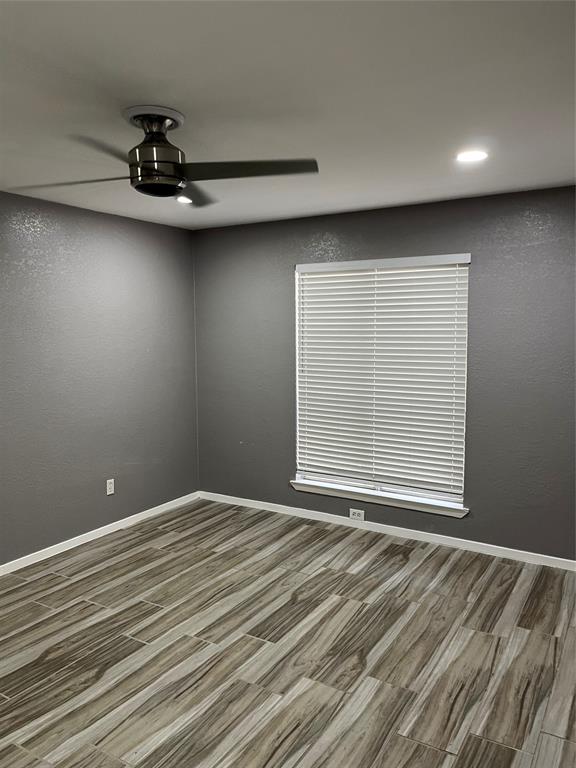 4845 Cedar Springs Road, Unit 170 Dallas, TX 75219 - Photo 20 of 26 a view of an empty room with a window