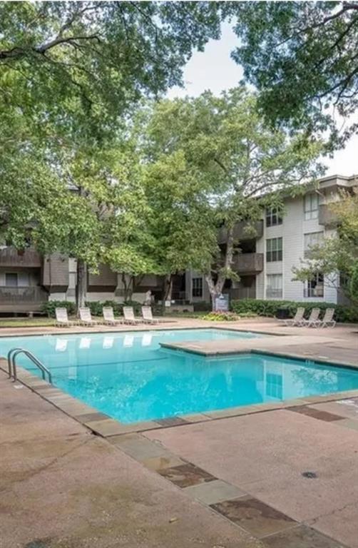 4845 Cedar Springs Road, Unit 170 Dallas, TX 75219 - Photo 5 of 26 a swimming pool with outdoor seating and yard