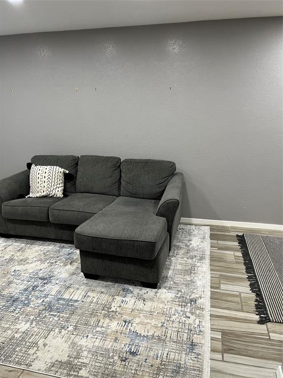 4845 Cedar Springs Road, Unit 170 Dallas, TX 75219 - Photo 10 of 26 a living room with a couch and a rug