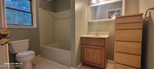 a bathroom with a sink toilet and vanity