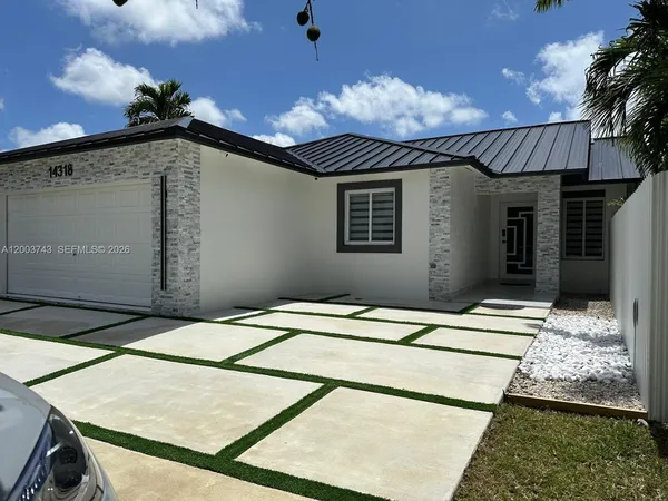 a view of a house with a garage