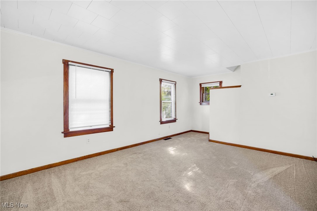 17 Ganyard Street Rittman, OH 44270 - Photo 6 of 16 Carpeted empty room featuring baseboards