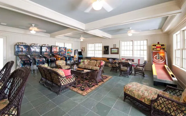 a living room with lots of furniture and a flat screen tv