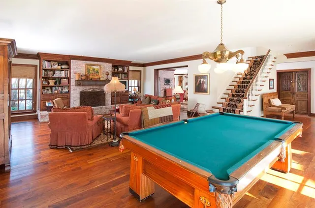 a living room with furniture and a large windows