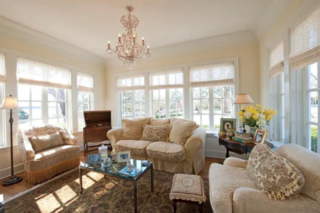 a living room with furniture rug and window
