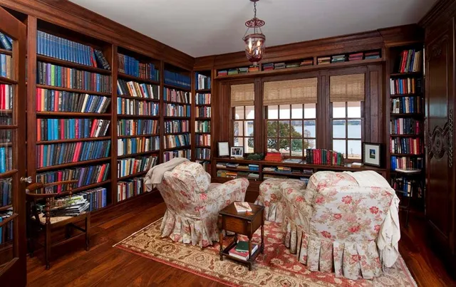 a living room with furniture a rug and a chandelier
