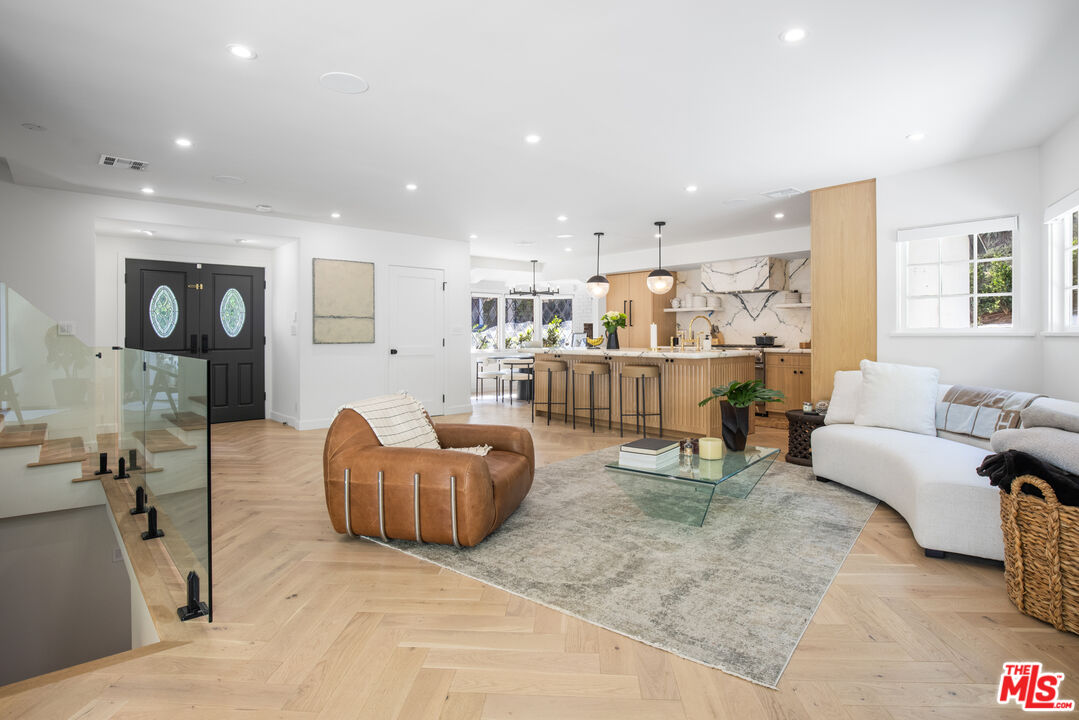 1570 Queens Road Los Angeles, CA 90069 - Photo 12 of 41 a living room with furniture and a wooden floor