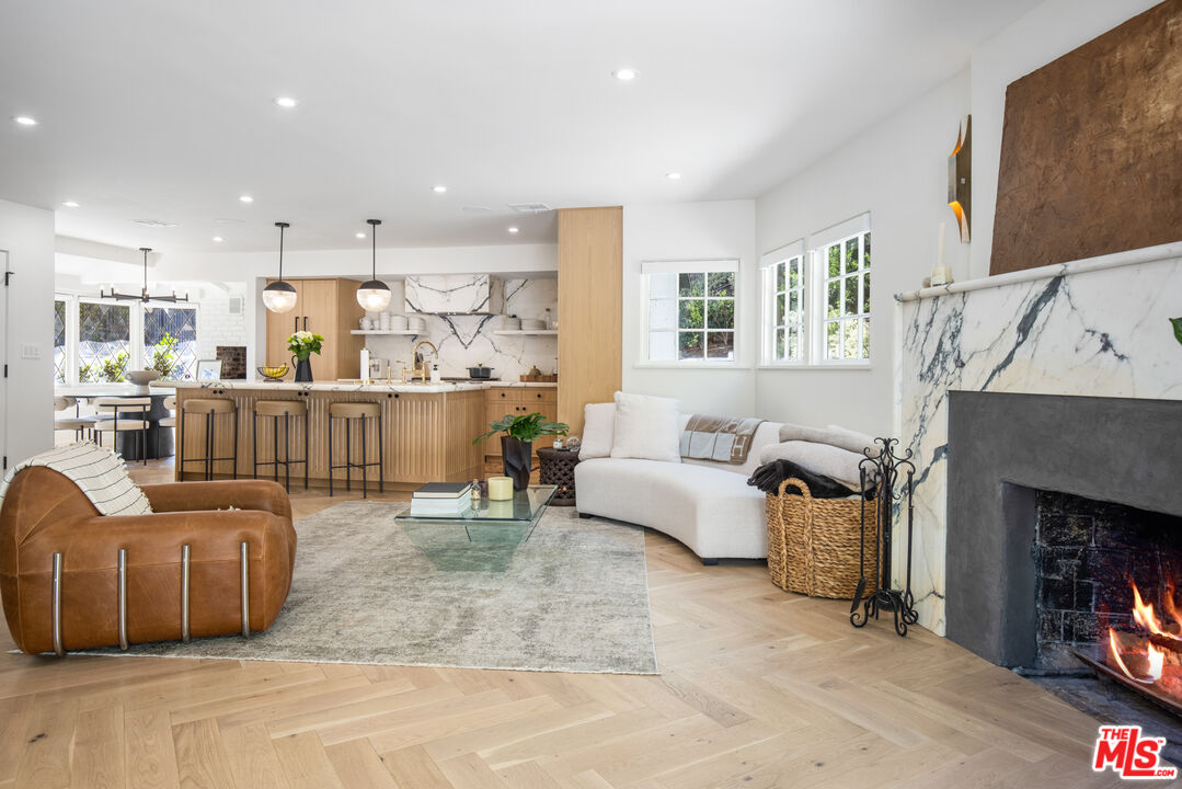 1570 Queens Road Los Angeles, CA 90069 - Photo 14 of 41 a living room with furniture and a fireplace