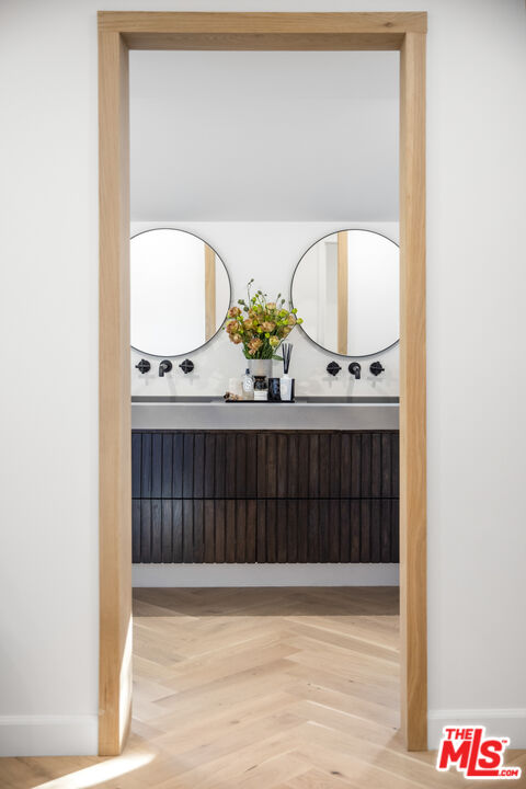 1570 Queens Road Los Angeles, CA 90069 - Photo 19 of 41 a view of staircase with mirror