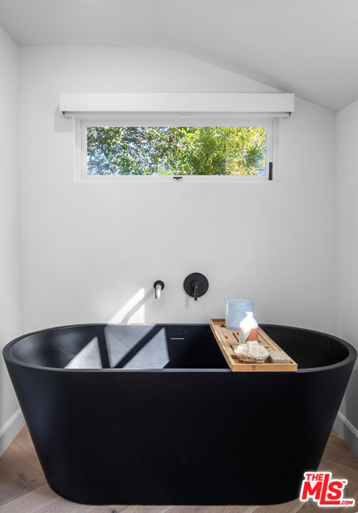 1570 Queens Road Los Angeles, CA 90069 - Photo 22 of 41 a table with a vase and window