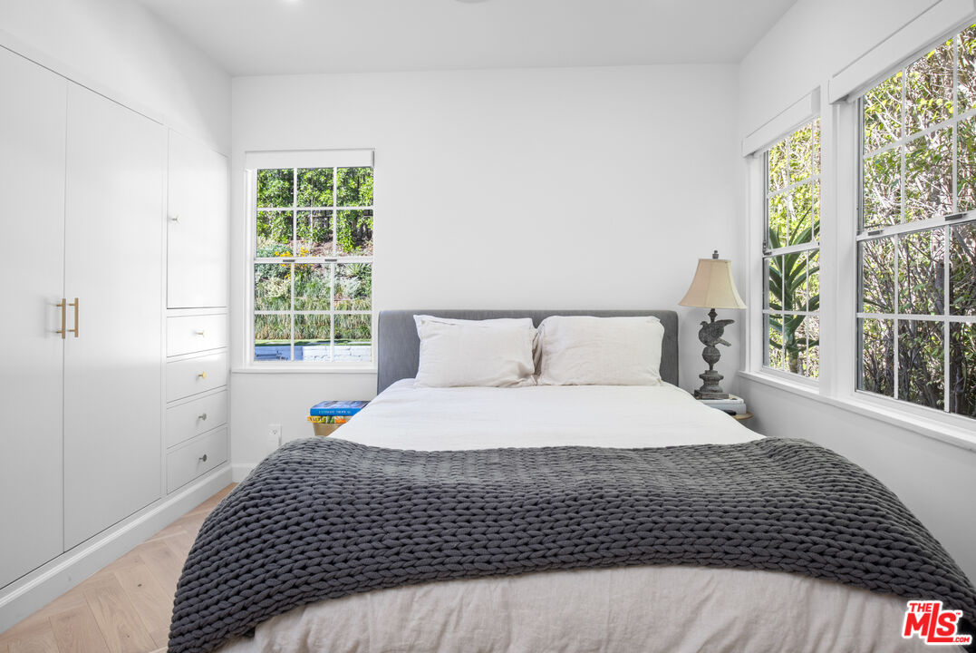 1570 Queens Road Los Angeles, CA 90069 - Photo 25 of 41 a bedroom with a bed and window