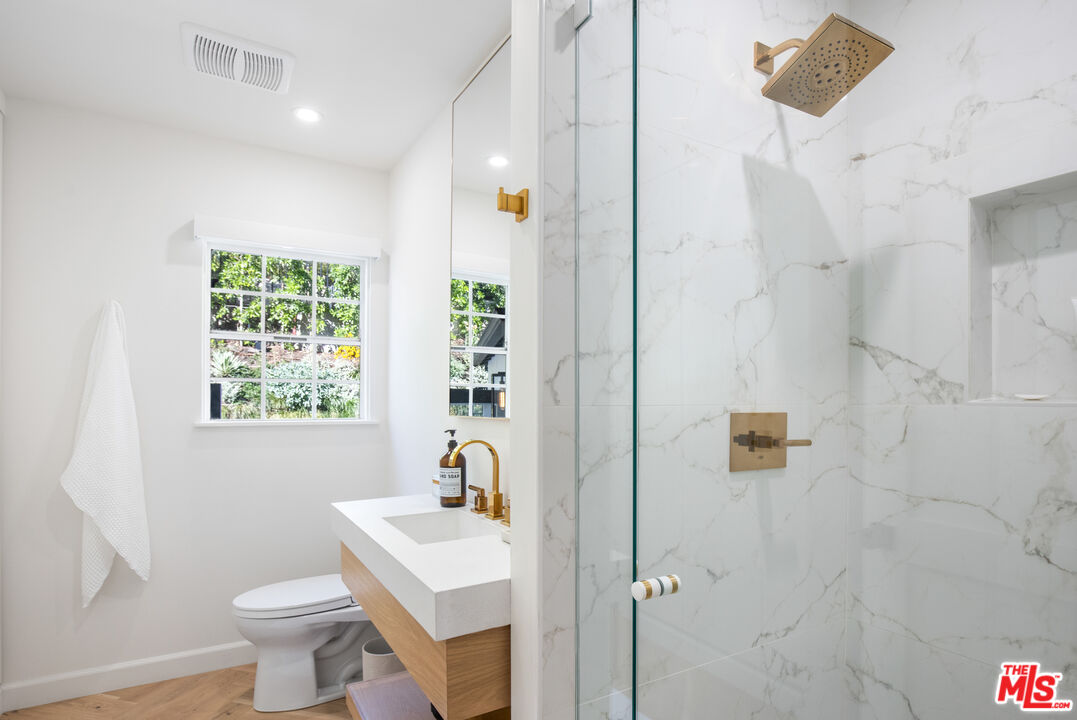 1570 Queens Road Los Angeles, CA 90069 - Photo 26 of 41 a bathroom with a sink toilet and shower