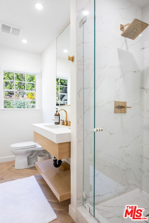 1570 Queens Road Los Angeles, CA 90069 - Photo 28 of 41 a bathroom with a sink a toilet and shower
