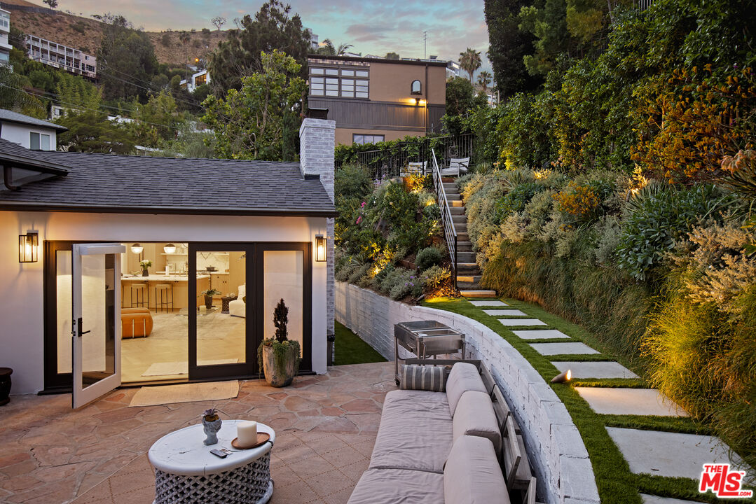 1570 Queens Road Los Angeles, CA 90069 - Photo 32 of 41 a front view of a house with a yard
