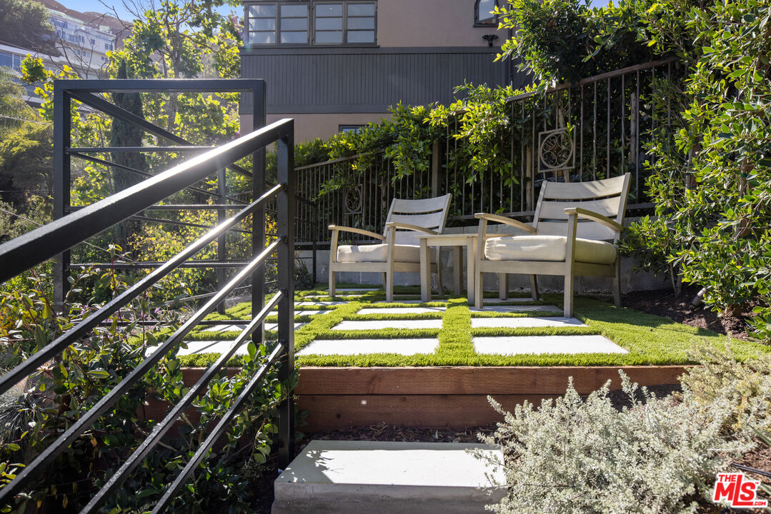 1570 Queens Road Los Angeles, CA 90069 - Photo 34 of 41 a view of swimming pool with a patio and a garden