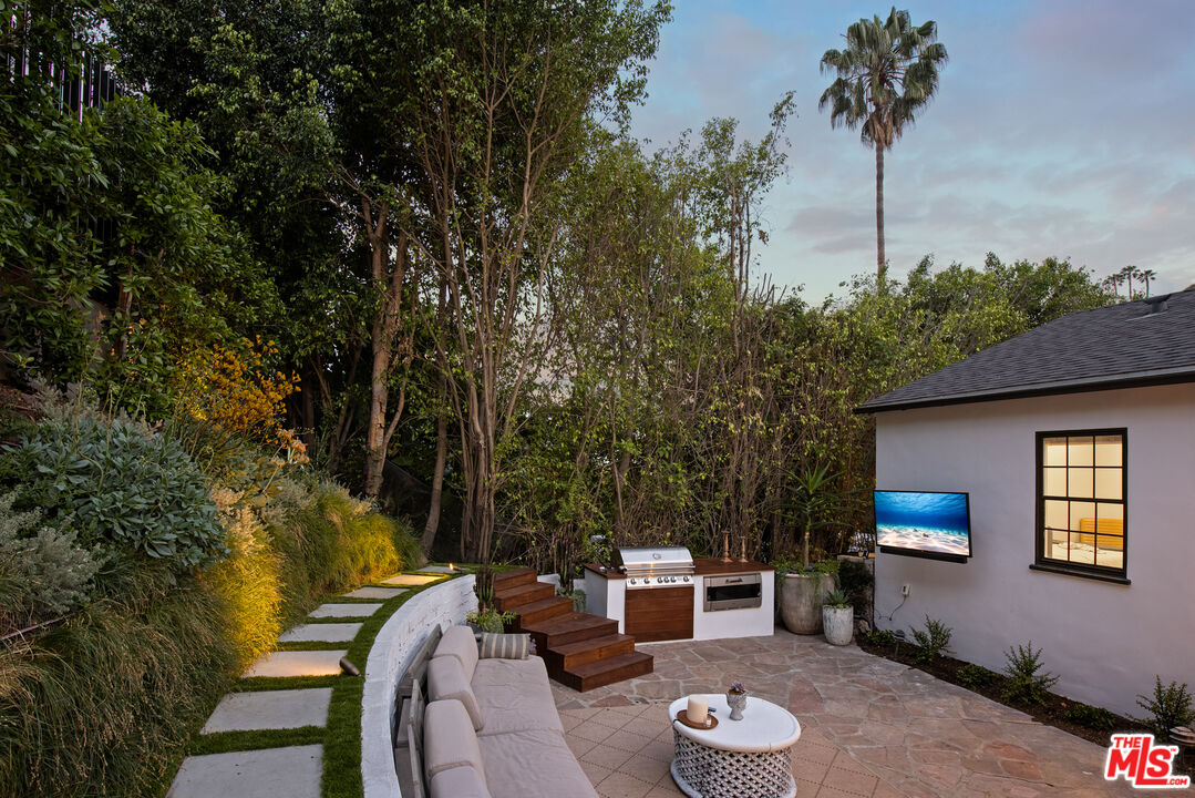 1570 Queens Road Los Angeles, CA 90069 - Photo 35 of 41 a view of a backyard with couches and a fire pit