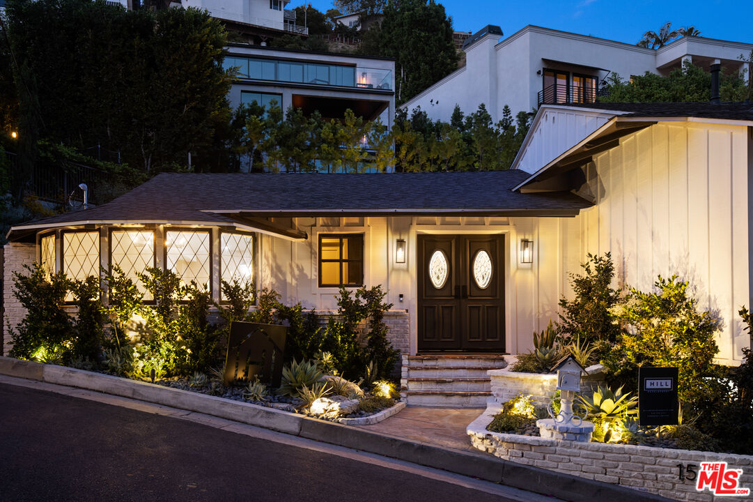 1570 Queens Road Los Angeles, CA 90069 - Photo 41 of 41 a front view of a house with a yard