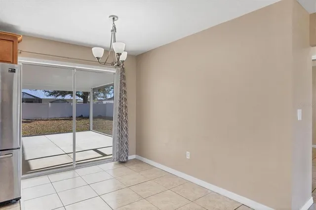 a view of a room with a glass door