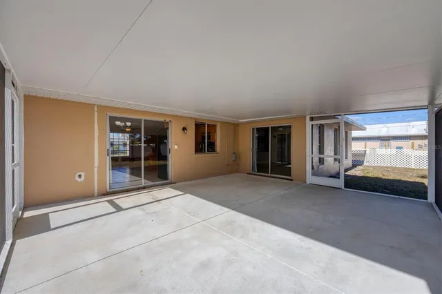 a view of a big room with windows and cabinet