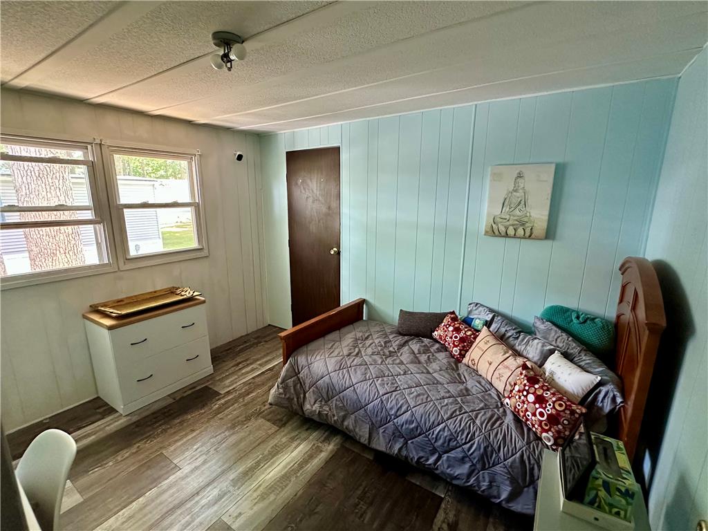 381 Red Oak Lane Bath, PA 18014 - Photo 17 of 27 Well-lit sleeping quarters with paneled walls and durable flooring.