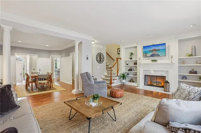 a kitchen with stainless steel appliances white cabinets and a refrigerator