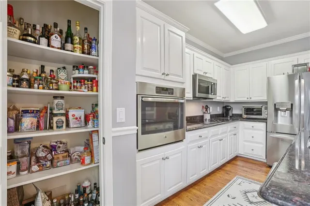 a spacious bedroom with a bed and a window