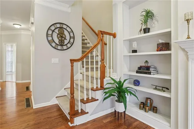 a bedroom with a bed dresser and a window