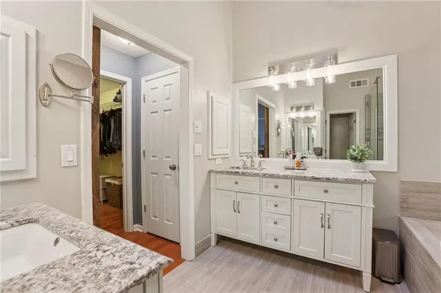 a bedroom with a large bed and a large window