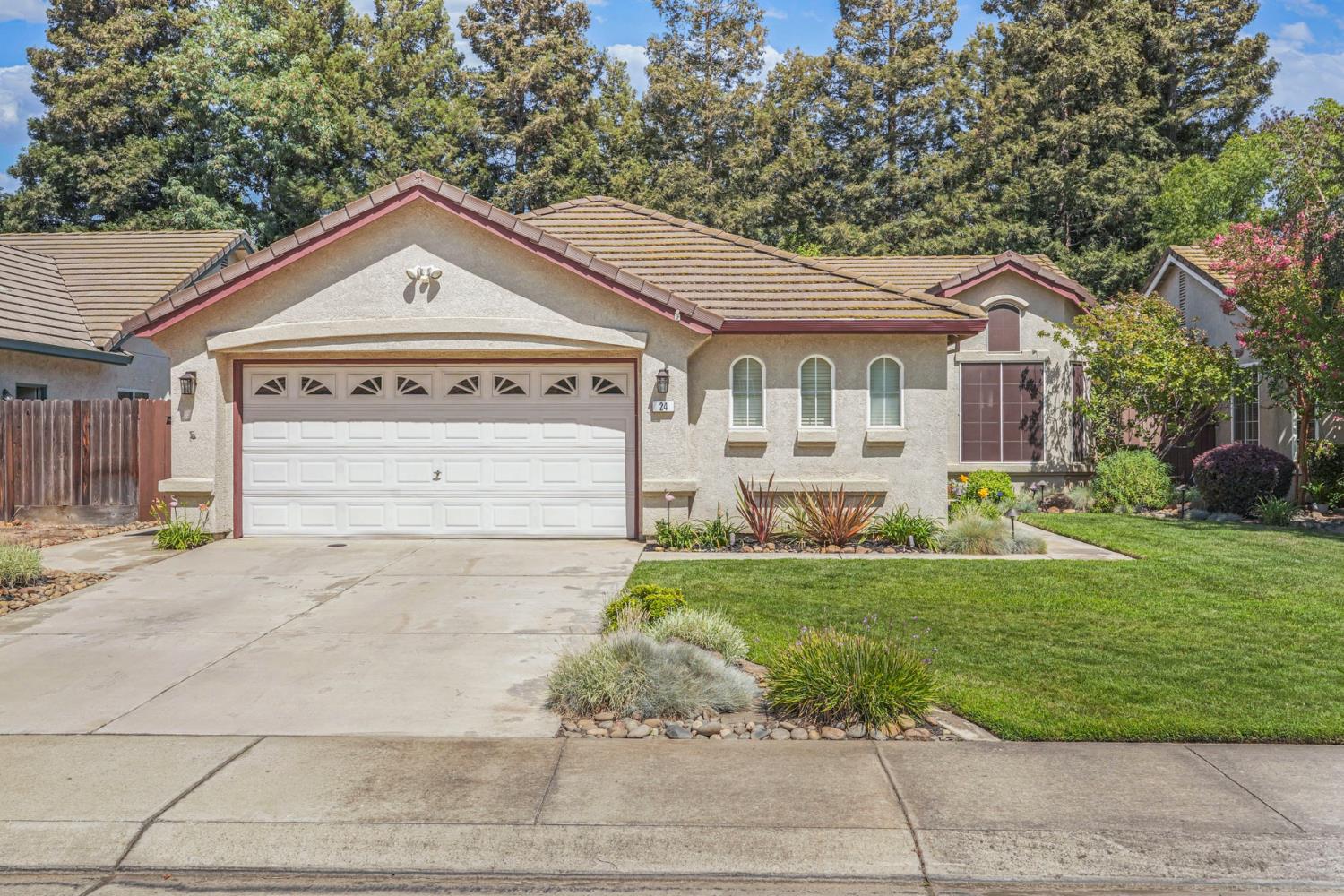 24 Elderica Way Lodi, CA 95242 - Photo 1 of 1 a front view of a house with a yard