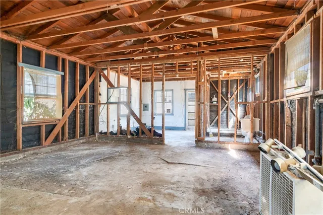 a view of an empty room with a balcony