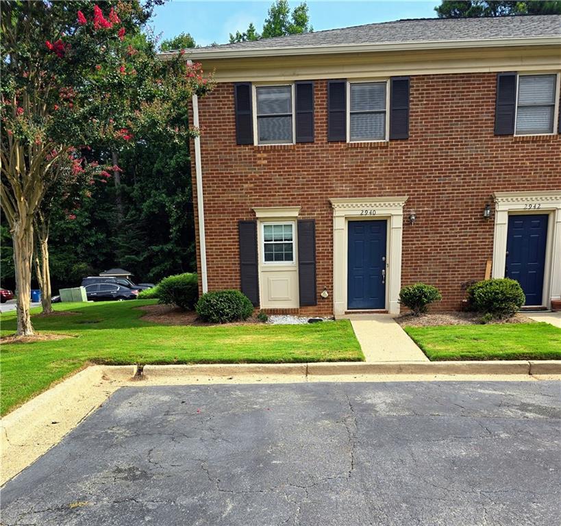 2940 Webb Bridge Road Alpharetta, GA 30009 - Photo 1 of 1 a front view of house with yard and green space