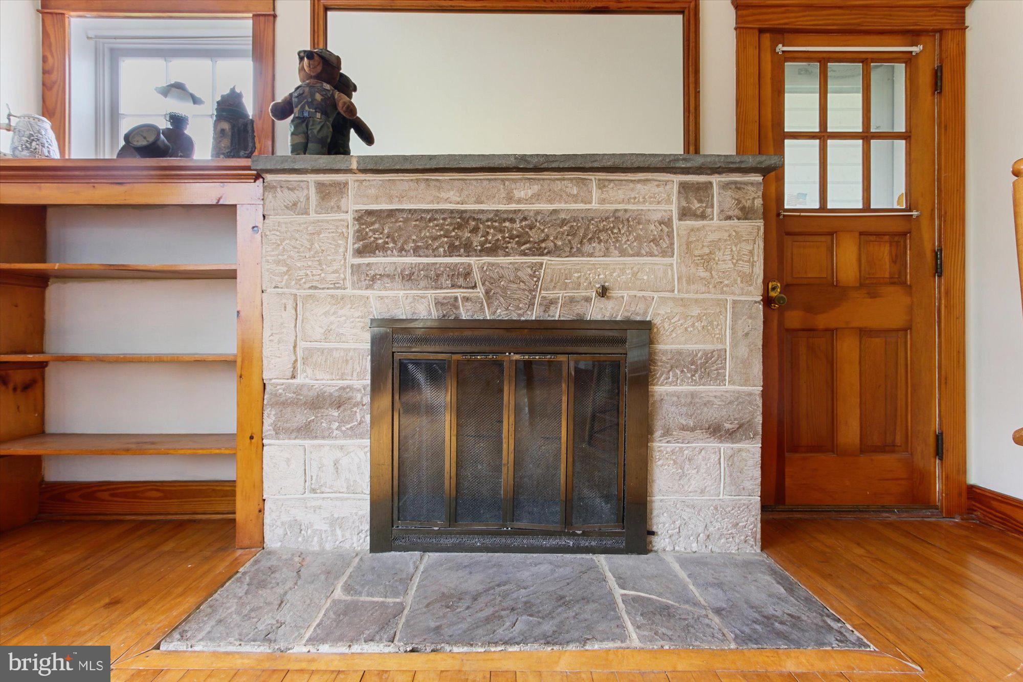680 Stoverstown Road York, PA 17408 - Photo 14 of 36 fireplace and door to outside covered patio