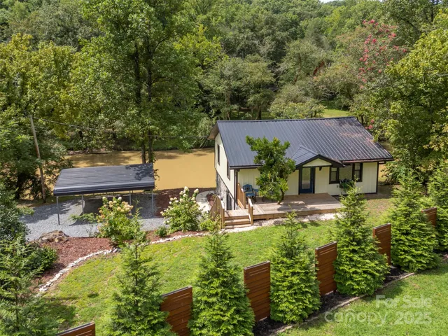 a view of a house with wooden fence