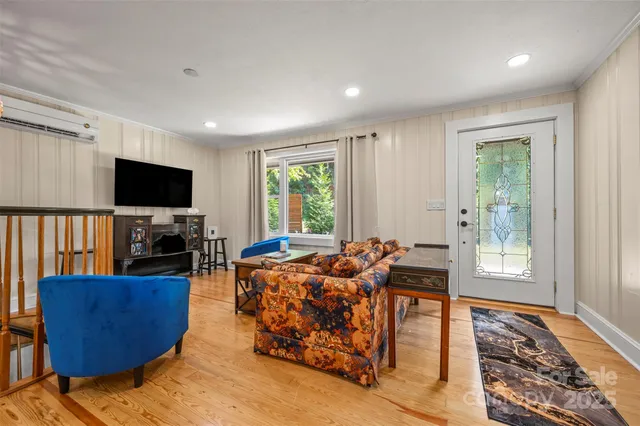 a kitchen with stainless steel appliances kitchen island granite countertop a stove a sink and a refrigerator