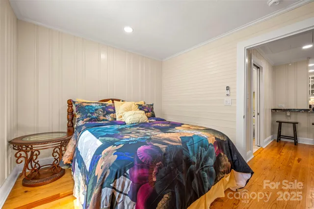 a balcony with wooden floor and outdoor space