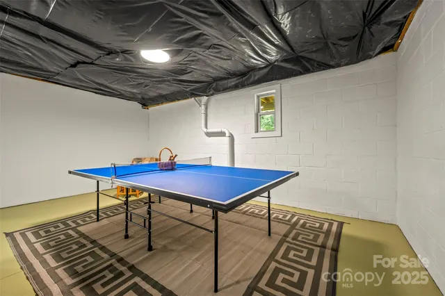 an aerial view of a house with garden space and a street view