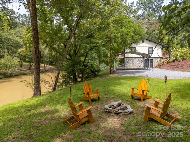 a view of a patio with table and chairs and wooden floor