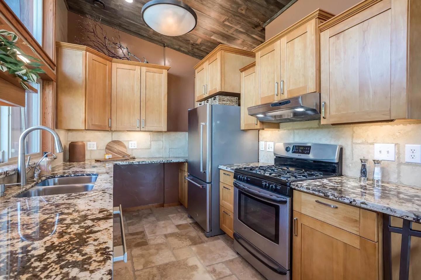 280 San Benito Road Brisbane, CA 94005 - Photo 13 of 63 a kitchen with stainless steel appliances granite countertop a stove a sink and a microwave