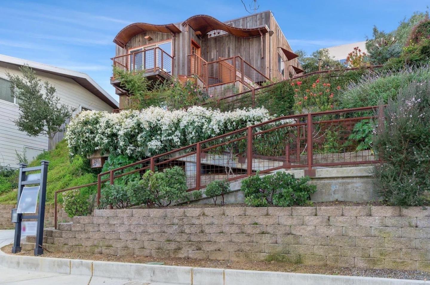 280 San Benito Road Brisbane, CA 94005 - Photo 2 of 63 a front view of a house with a yard