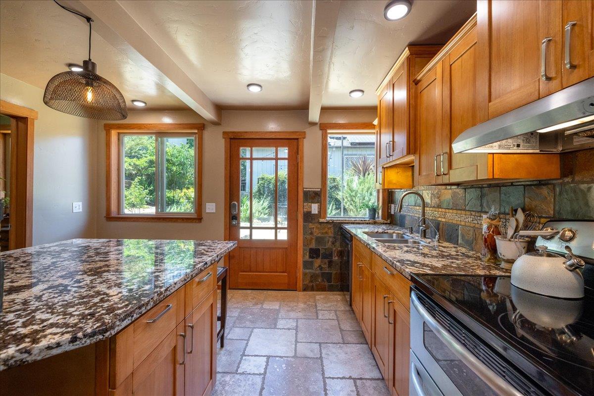 280 San Benito Road Brisbane, CA 94005 - Photo 30 of 63 a kitchen with stainless steel appliances granite countertop a stove a sink and a wooden cabinets