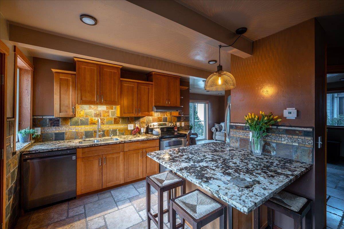 280 San Benito Road Brisbane, CA 94005 - Photo 36 of 63 a kitchen with a table and chairs in it